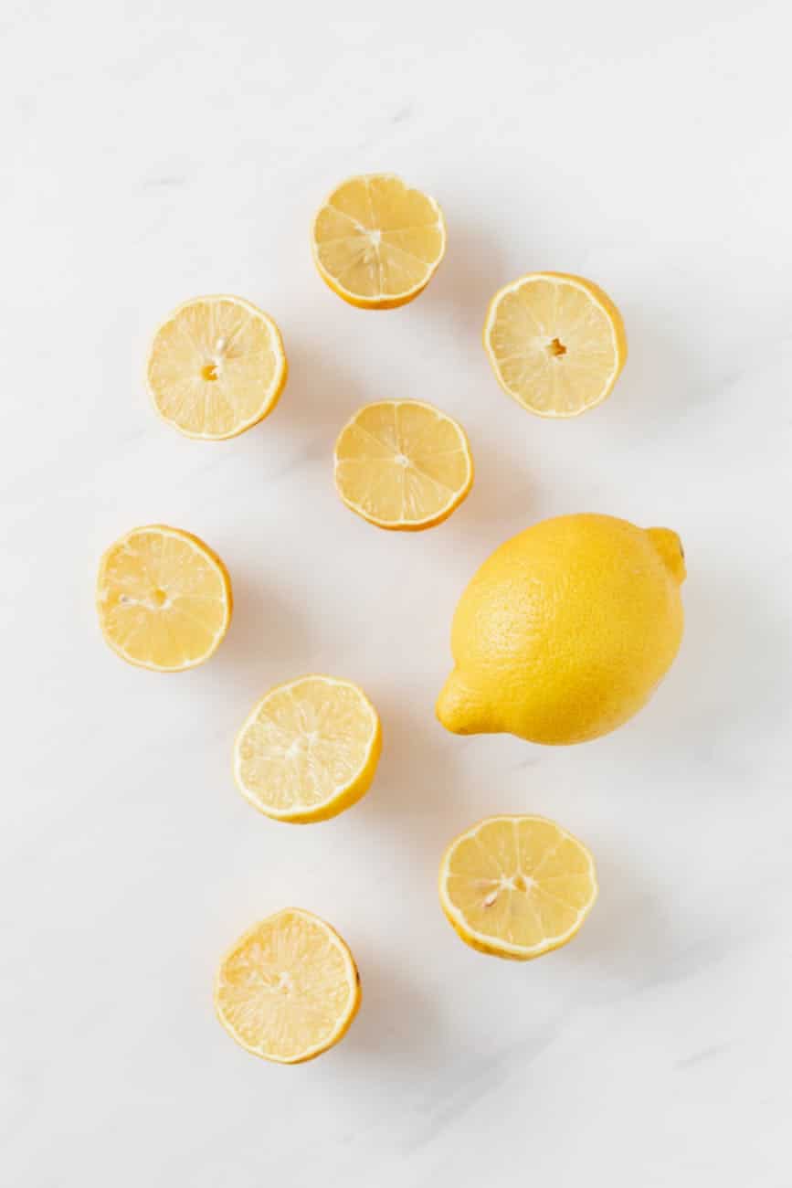 composition of fresh lemons on white surface