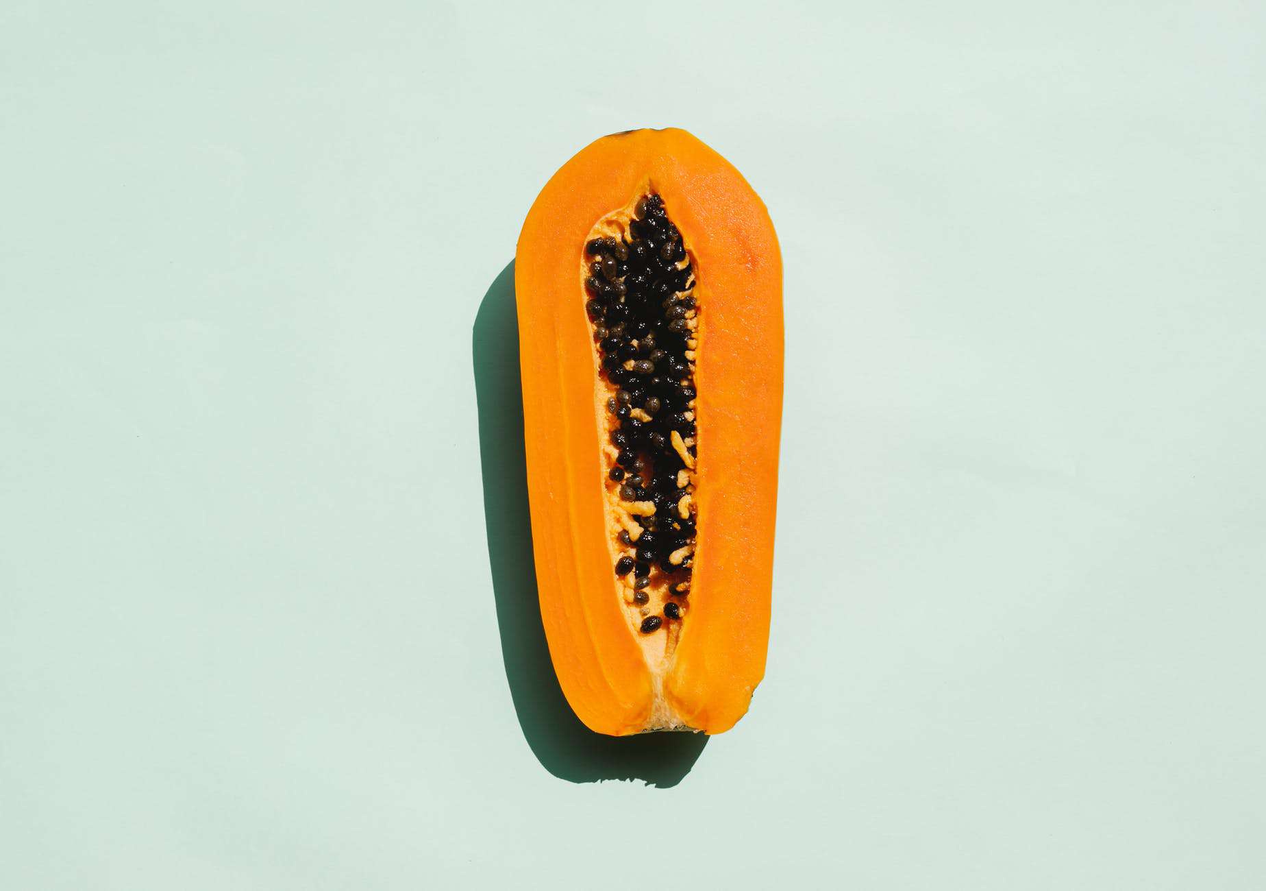 half of exotic ripe papaya with seeds