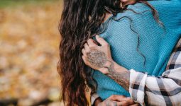crop couple hugging in park