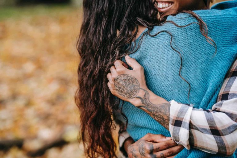 crop couple hugging in park