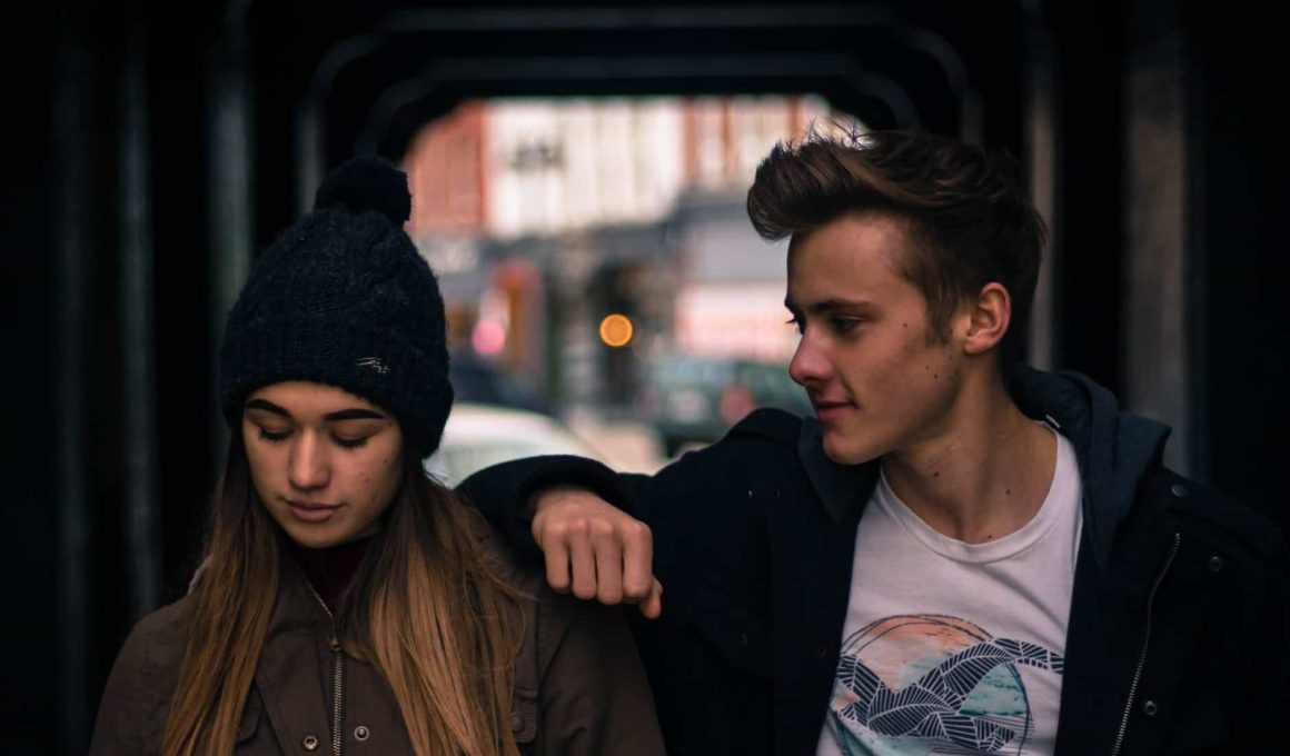 young couple in city at night