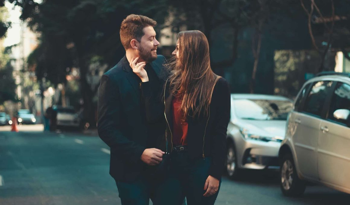 romantic young couple bonding on street