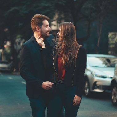 romantic young couple bonding on street