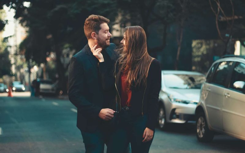 romantic young couple bonding on street