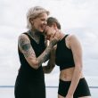 women laughing on beach