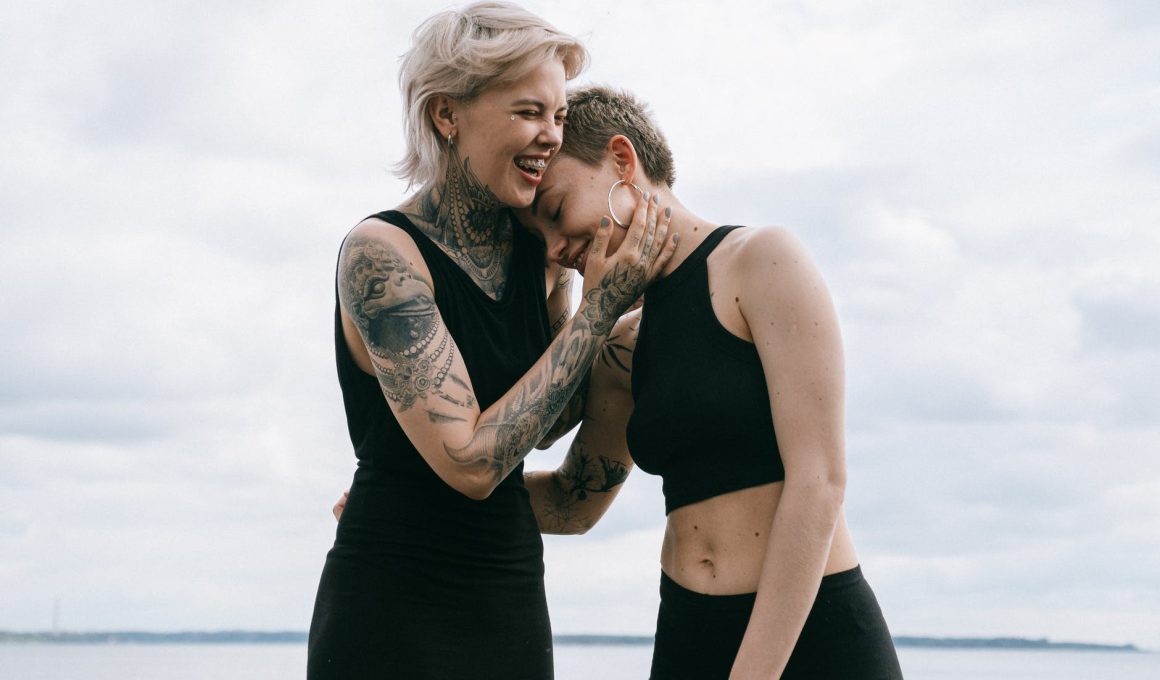 women laughing on beach