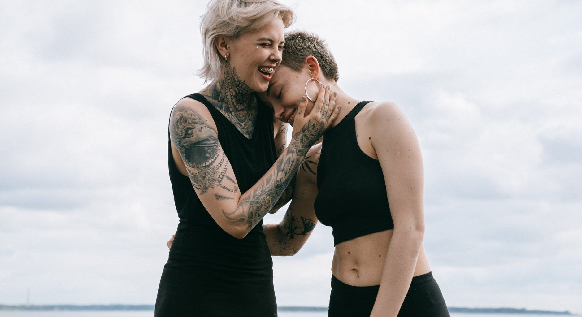 women laughing on beach