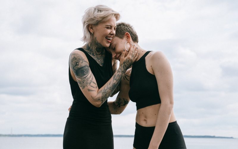 women laughing on beach