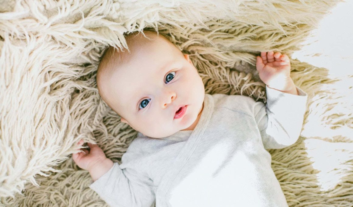 baby in white onesie