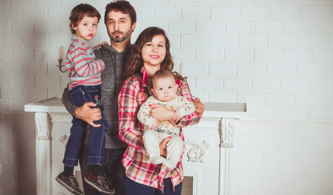 standing family near fireplace