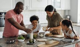 family making breakfast in the kitchen