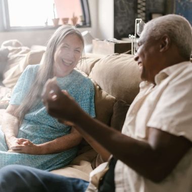 eldelry couple laughing together