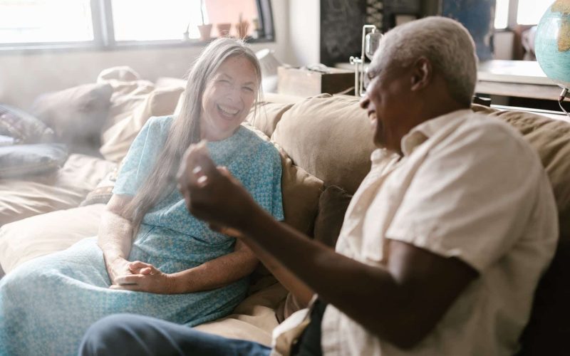 eldelry couple laughing together