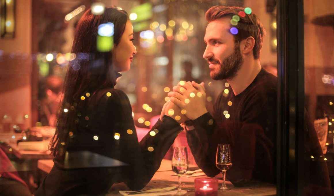 photography of couple holding hands