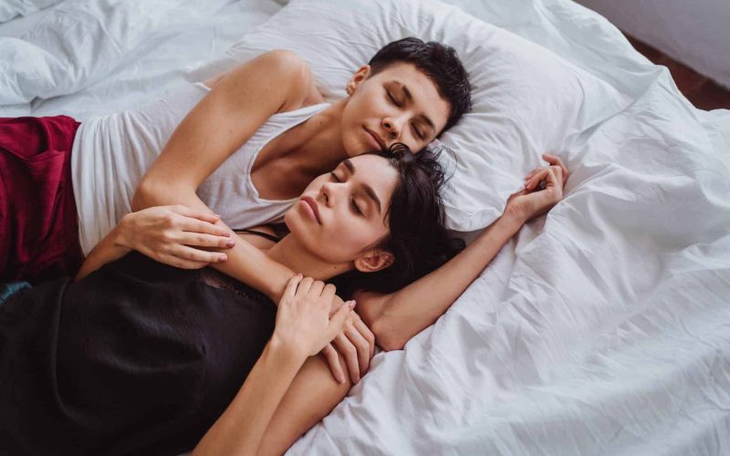 two women sleeping together